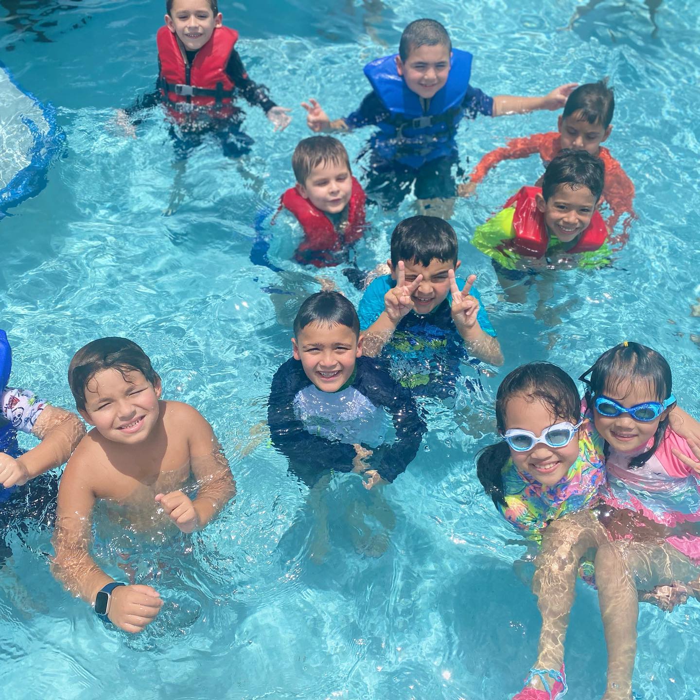 Kids making friends quickly at Miami summer camp through group activities