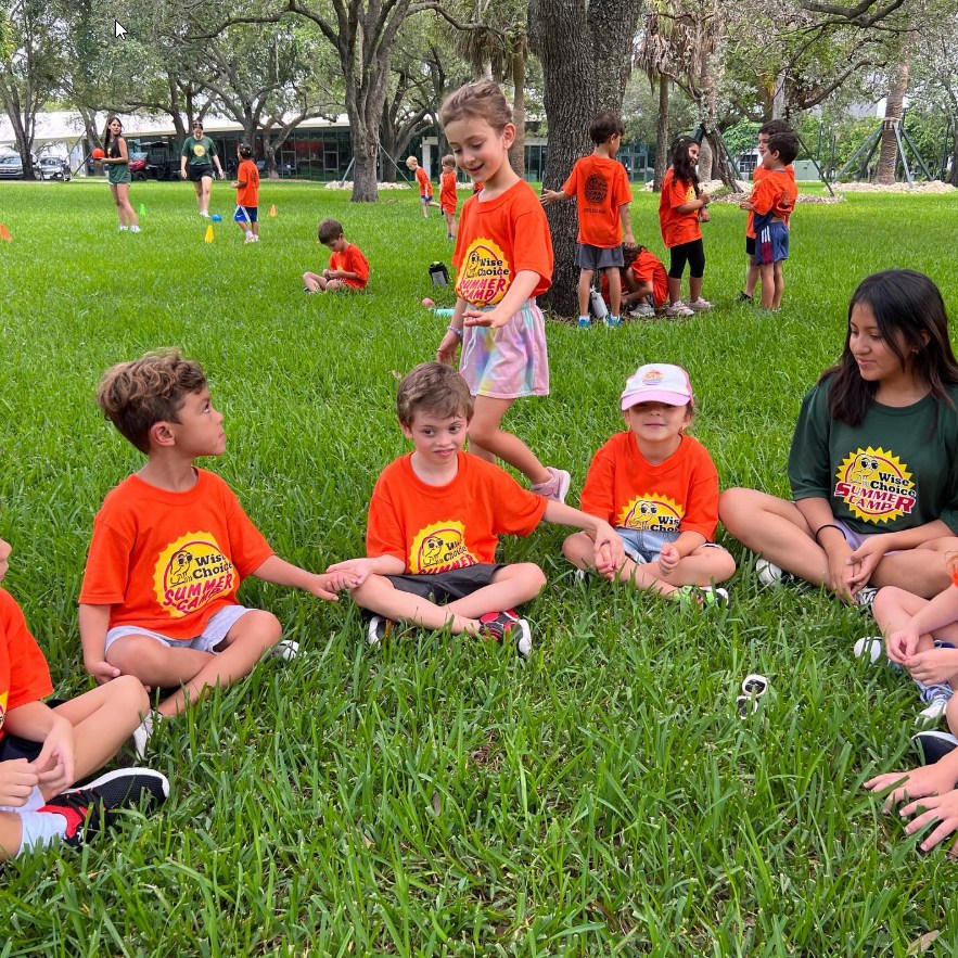 Kids enjoying summer camp activities in Miami, considering the best camp duration for their needs