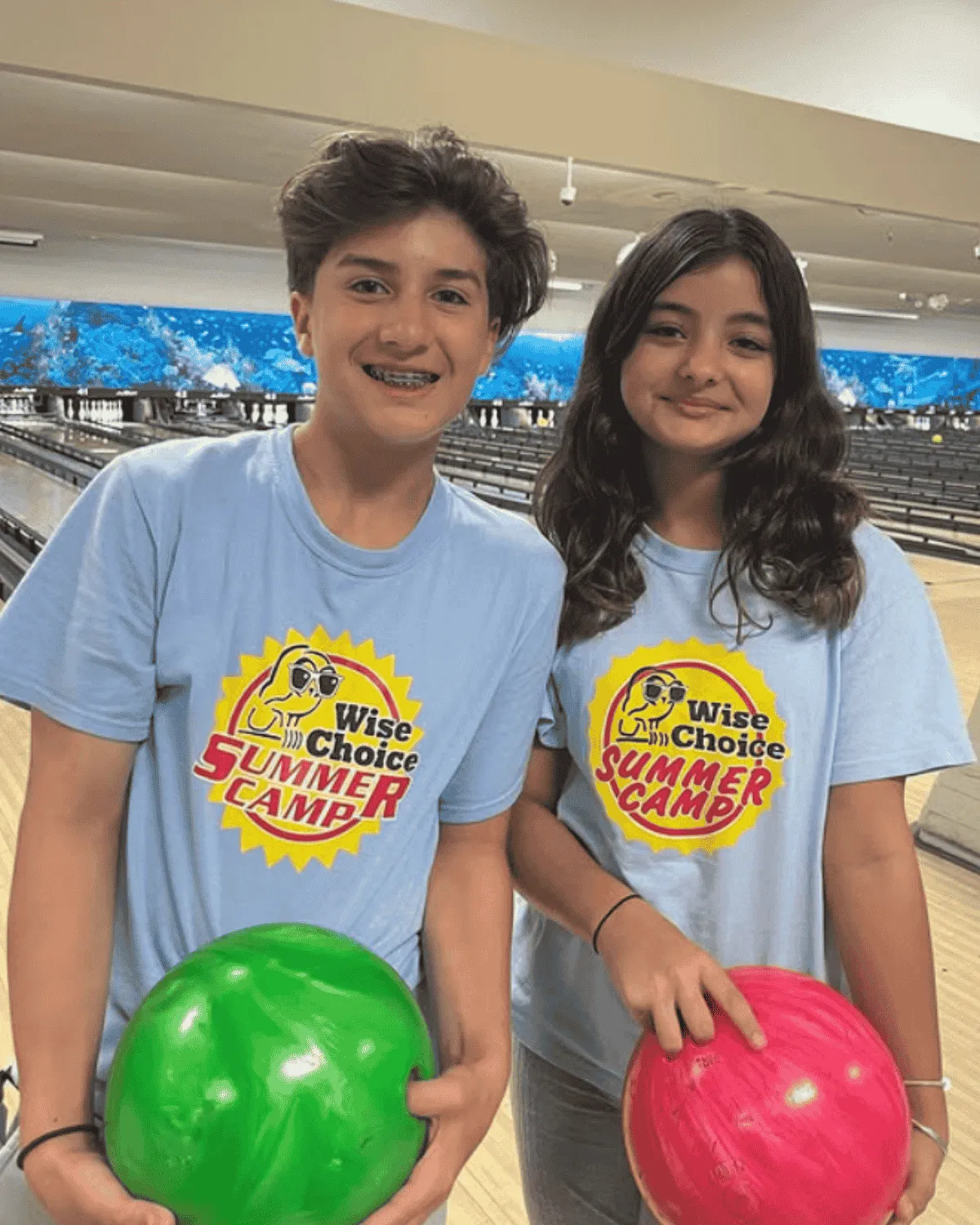 Kids enjoying indoor activities at Miami summer camp on a rainy day